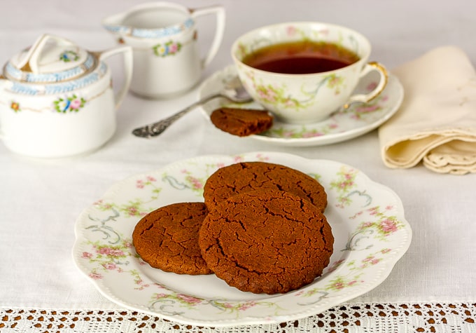 cinnamon snap cookies and tea on antique china 