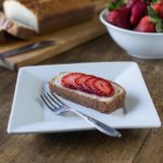 Aunt Lou's Feather Cake on a plate with strawberries
