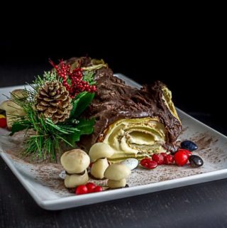 Traditional French buche de noel Christmas cake with almond cream filling. | ethnicspoon.com