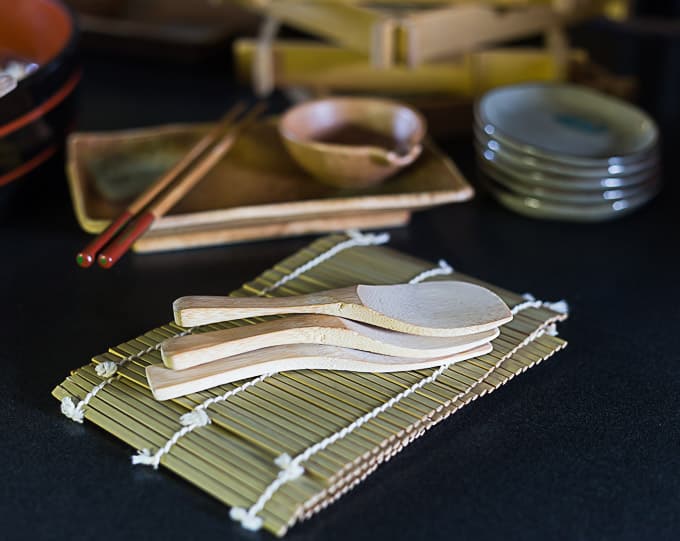 sushi rice paddles and two bamboo mats