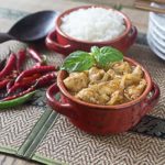 thai red curry chicken in a red bowl