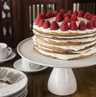 A traditional Swedish Tusenbladstårta, translated means thousand leaves torte or in English spelled as Tusenbladstarta. cinnamon flavored flakey pastry surrounded by vanilla custard cream. Fantastic! | ethnicspoon.com