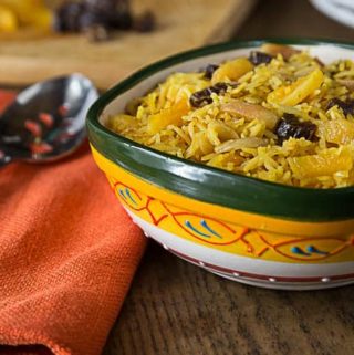 Fantastic flavors of sweet and savory basmati rice with almonds, apricots dates and sazon with saffron. A super simple dish with fantastic flavors! | ethnicspoon.com