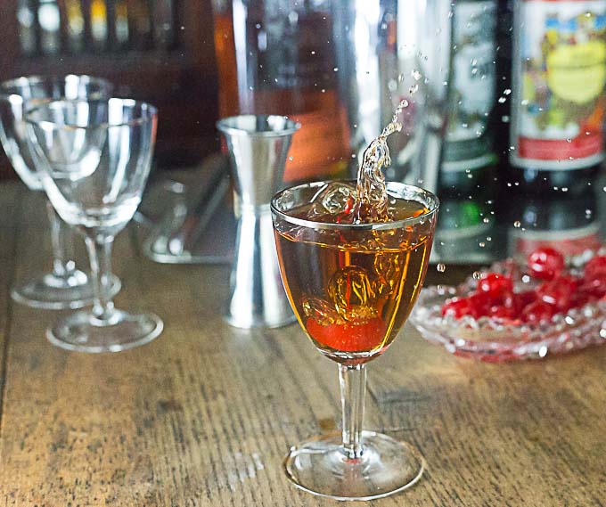 Manhattan Coctail recipe: The "perfect" style will blend in sweet and dry vermouth and the classic only uses sweet vermouth. Take your choice of a favorite whiskey: bourbon, rye, Canadian or Irish. Stir, strain and serve up or on the rocks. | ethnicspoon.com | ethnicspoon.com