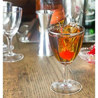 How to make a classic manhattan cocktail and a "perfect" manhattan. The "perfect" style will blend in sweet and dry vermouth and the classic only uses sweet vermouth. Take your choice of a favorite whiskey: bourbon, rye, Canadian or Irish. Stir, strain and serve up or on the rocks. | ethnicspoon.com | ethnicspoon.com