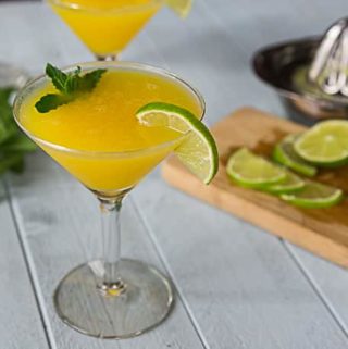 Enjoy the summer heat with a frozen mango rum cocktail with mint! Sweet, tart and delicious! | ethnicspoon.com