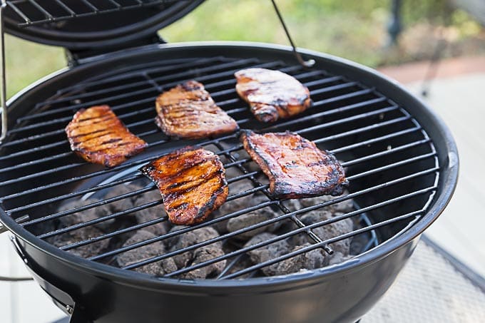 Grilling boneless pork chops in a spicy Korean BBQ sauce