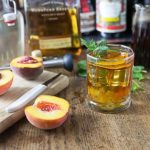 Refresh on a hot summer day with a bourbon peach tea smash. I love local peaches in this is a delicious cocktail! | ethnicspoon.com