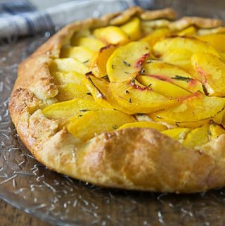 A rustic dessert that is simple to make! Fresh peach crostata with a creamy Neufchatel filling! It one of my favorite farm to table desserts! | ethnicspoon.com