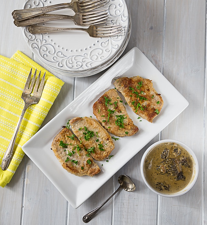 pork chops on a tray with parsley