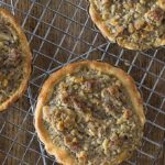 You will love these Tartelettes au Noix! French walnut tartlets are crunchy and creamy caramelized filling with a hint of orange and similar to pecan pie. | ethnicspoon.com