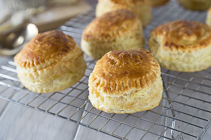 spicy chicken puff pastries on a drying rack