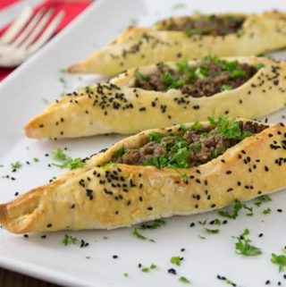 Here is a fun dish to try! Try a simple and exotic Lebanese lamb fatayer with a simple dough and an incredible spice mixture. This is a Lebanese version of a calzone and will be a family favorite and fun to make too! | ethnicspoon.com