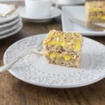 Try this Swedish almond cake with you next cup of coffee! Light and airy Swedish almond cake makes a wonderful dessert your family will love! A nice meringue is folded into ground almonds and flour. Once it is baked you add a creamy almond custard like filling and topping. | ethnicspoon.com