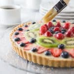 The best ever fruit tart from scratch and simple to make! This has a creamy vanilla filling with a nice crunchy shortbread crust topped off with fresh fruit! Delicious! You are going to love the French patisserie style tart! It’s so simple to make, bake the shortbread crust, whip together the filling and add to the crust and add the fruit. | ethnicspoon.com