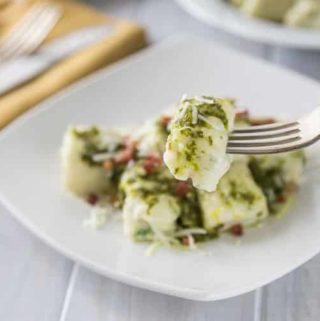 a plate of ricotta gnocchi with pesto