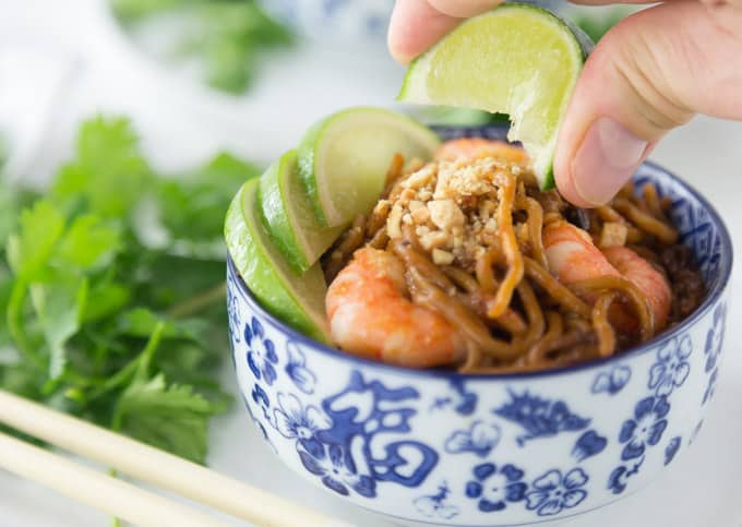 Here is a tasty weeknight meal! Super easy shrimp pad thai can be ready in about 5 minutes! Add some fresh cilantro, limes and chopped peanuts! So Good! | ethnicspoon.com