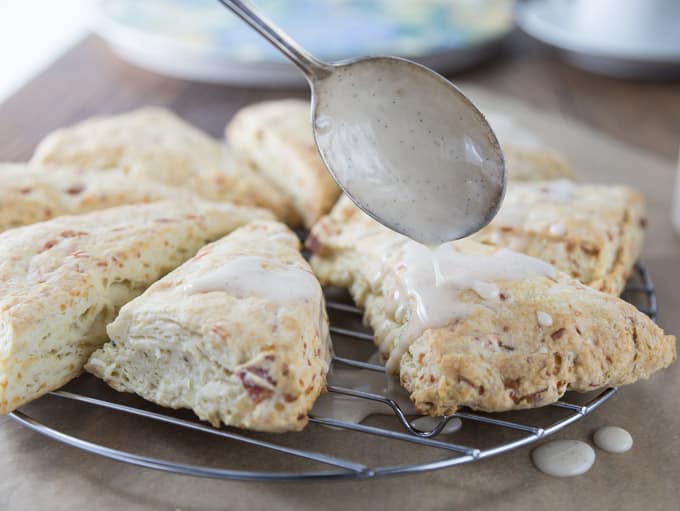 My family’s favorite scones! Everything’s better with bacon but how about bacon scones with maple glaze? You are going to love these cheesy bacon scones. These have Gruyere, fresh thyme, bacon and the sweet maple glaze for a nice savory and sweet combination. | ethnicspoon.com