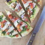 Chicken flatbread pizza with cilantro almond pesto, queso freso and spicy RO*TEL tomatoes and chiles. So good! | ethnicspoon.com