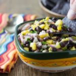 Need a dish for a summer picnic? Try this super easy mango black bean salsa! This is my go-to dish to bring to summer picnics. If you can chop and stir this is the salsa for you! I love the sweet, savory and spicy flavors this dish brings. | ethnicspoon.com