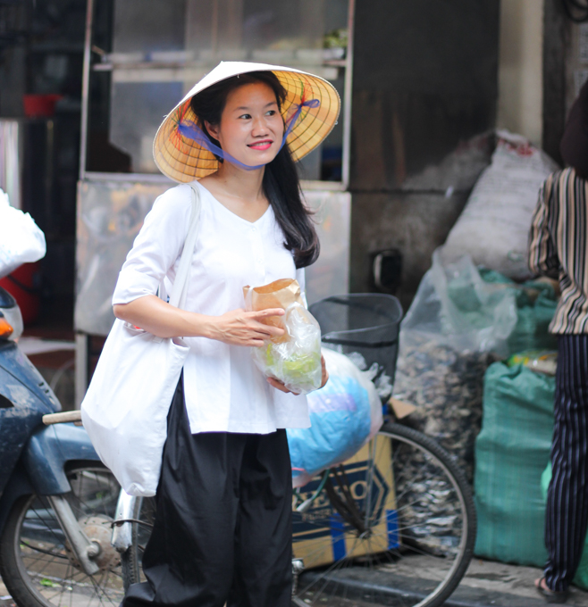 Thanh shopping in the market in Hanoi