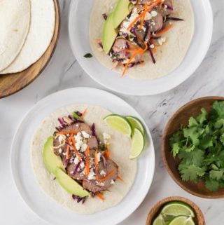 two plates with texas smokehouse tacos