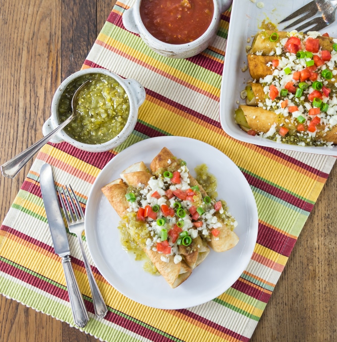 Like Mexican food? You will love the flautas! I like to drop my Mexican three cheese flautas in a hot pan with a little oil to give them a nice color and then I bake them with salsa verde and some queso fresco on top. I love Mexican food! This recipe is so easy to make too! | ethnicspoon.com