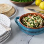 The is a very refreshing and healthy salad you will often find at Middle Eastern restaurants. Here is a really simple recipe for an authentic tabouleh made with cracked bulgur wheat, parsley, tomato, feta, mint, lemon juice and onion. There is some variation on the spelling of tabbouleh or tabouli, no matter how you spell it you will love this salad with it's fresh flavors! | ethnicspoon.com