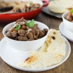 Try this fantastic dish from Kashmir that has its origins from Persia. Spicy and rich rogan josh is an easy Indian dish to prepare in your dutch oven or slow cooker. The mixture of spices is what gives this amazing spicy lamb stew its deep, rich, and aromatic taste. I used my homemade garam masala as well as other spices. If you like curry dishes you will love this dish. | ethnicspoon.com