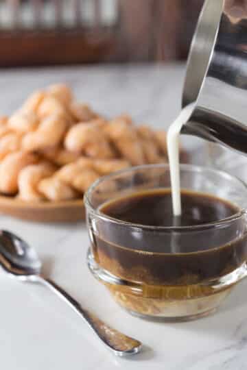 A photo of Vietnamese coconut coffee in a clear cup.
