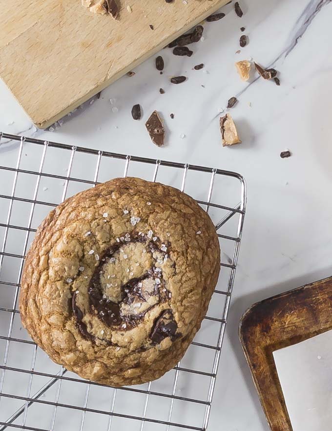 english toffee chocolate cookie on a cooling rack