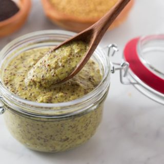 Homemade mustard makes a big batch so you can share it with friends. Buy some mustard seeds and soak them to make your own homemade mustard. Homemade mustard is so easy and you can explore new flavors too! Try this Irish cider tarragon mustard on some sausages or roast beef! This spicy whole grain pungent mustard is not for the faint of heart. You will enjoy the kick this brings but also has some subtle flavors too! | ethnicspoon.com