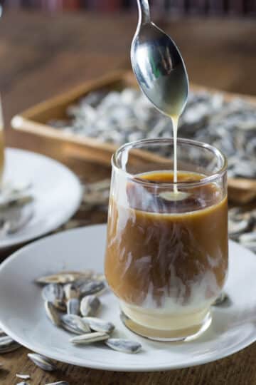 A photo of Vietnamese iced coffee in a cup in a saucer.