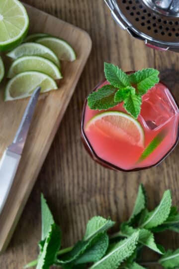 An overhead shot of a Guava lime cocktail with mint.