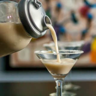 A photo of horchata being poured into a martini glass