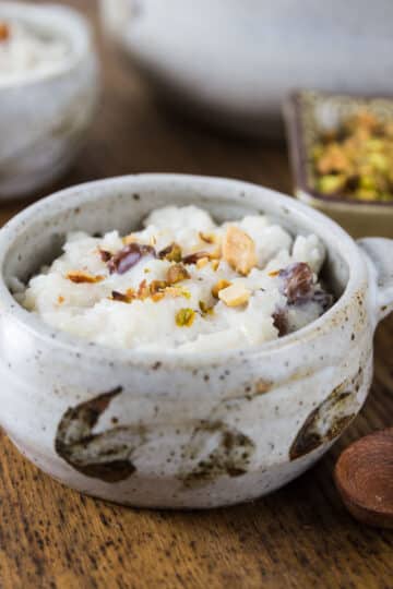 A photo of Indian kheer rice pudding in a ceramic bowl.