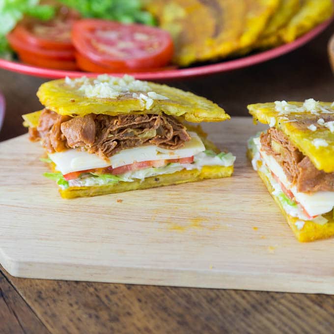 A photos of a jibarito sandwich on a cutting board.