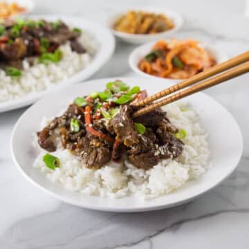 A photo of Korean beef bulgogi on a plate with rice.