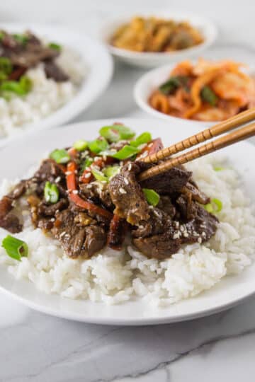 A photo of Korean beef bulgogi on a plate with rice.