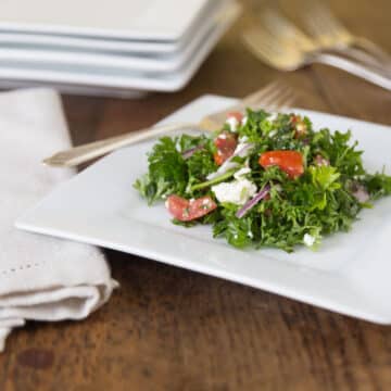 A white plate with Mediterranean parsley salad.