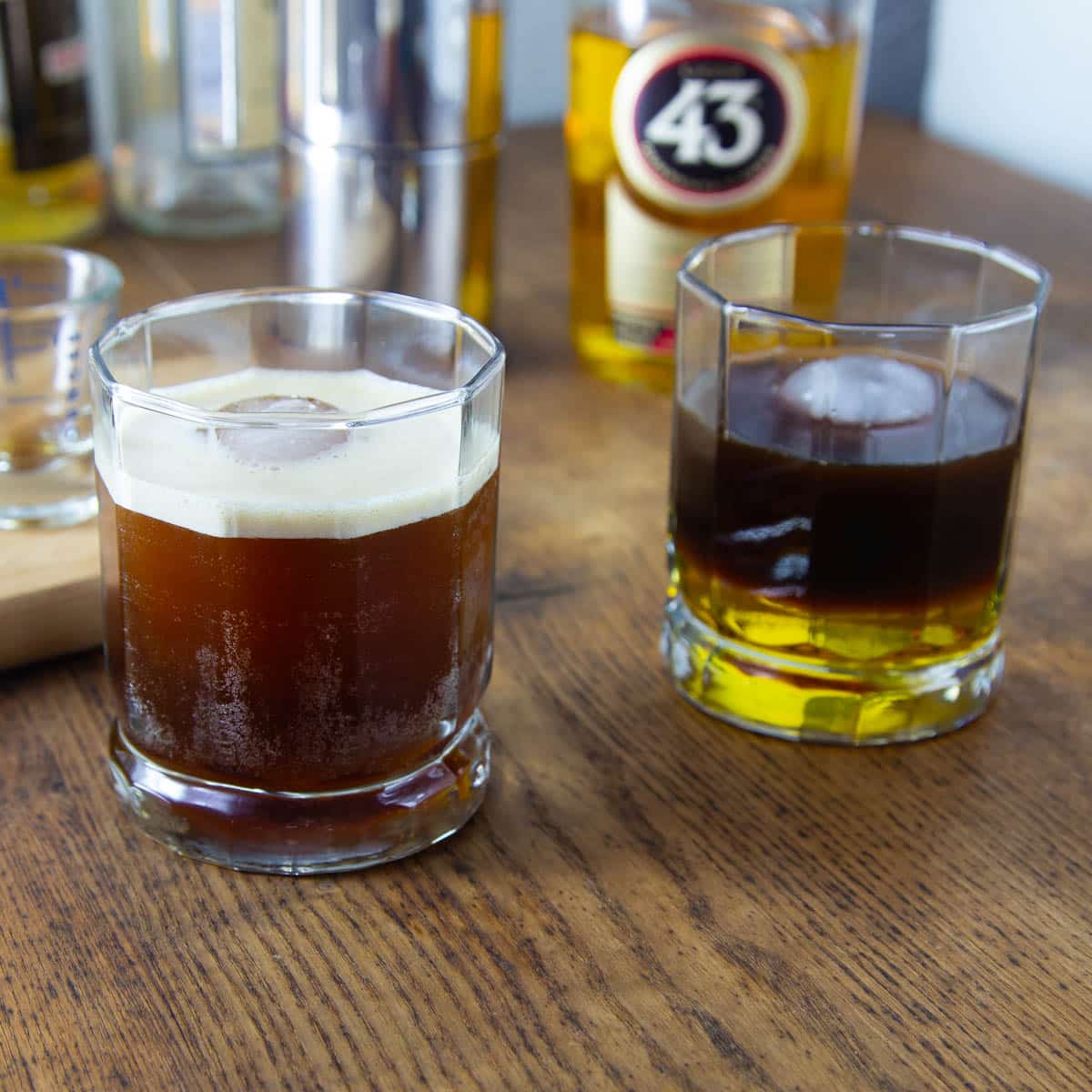 A photo of two carajillo cocktail, one poured in layers and another shaken.