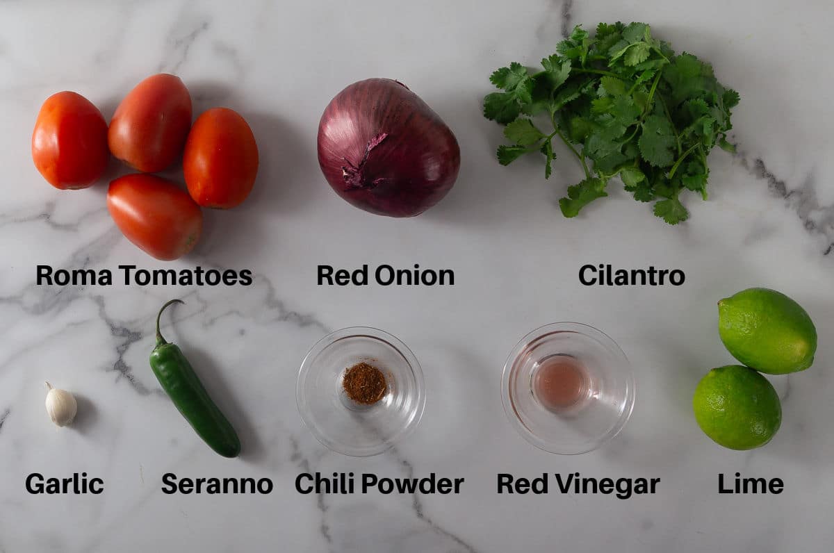 A photo of the ingredients to make pico de gallo.